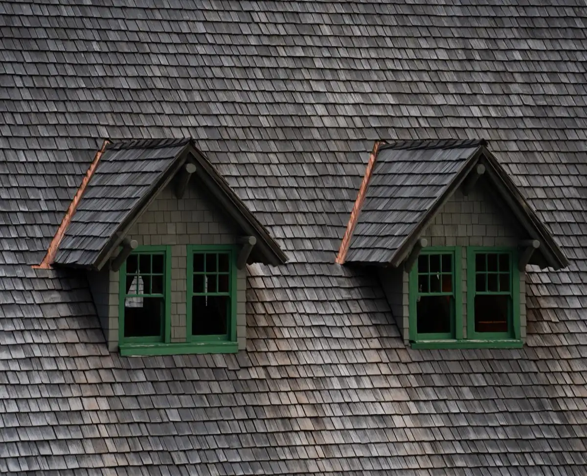 Dormers on a shingle roof in Joplin, MO, where step flashing and kickout flashing carry water past the walls