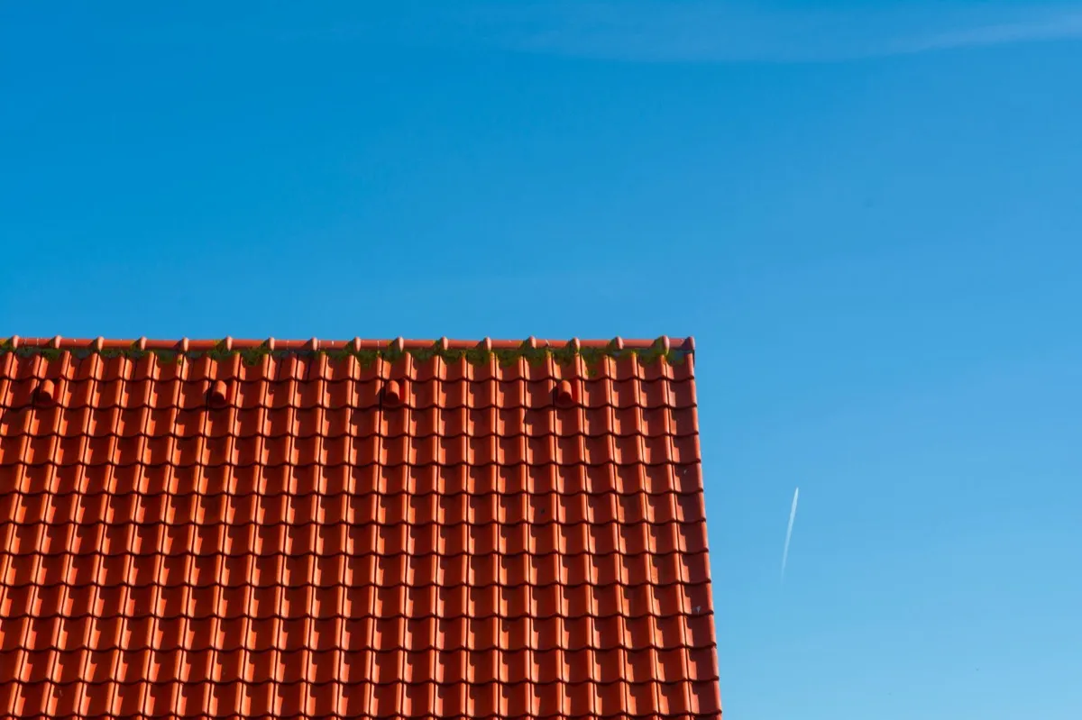 Tile roof gable in full sun, the kind of exposure that sets roof life in Joplin, MO